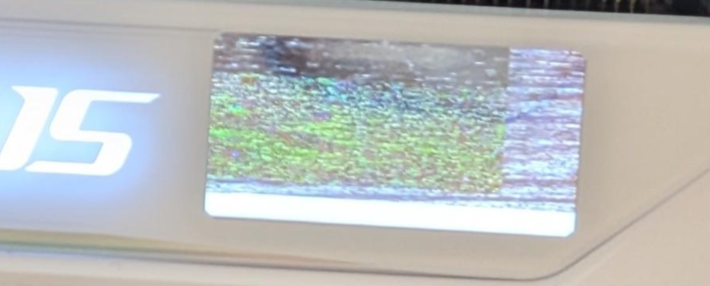 AORUS LCD panel showing corrupted custom media before repair